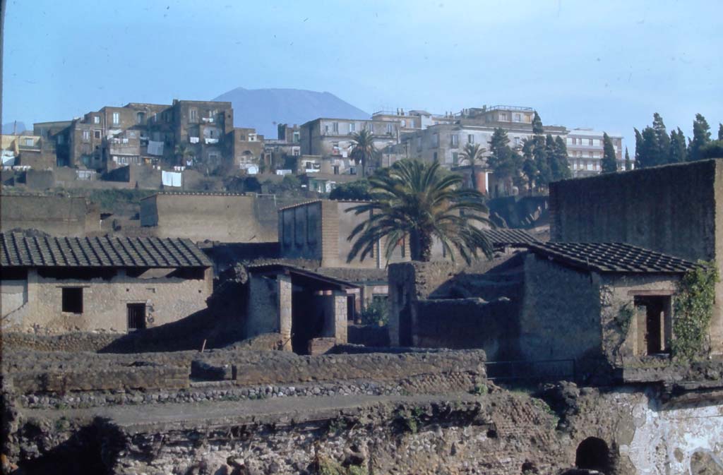 III, 19/18/1, Herculaneum. 4th December 1971. 
Looking north-east from access roadway towards rooms on east side near doorway at III.19, on left and centre.
On the right is part of IV.1/2, House of Mosaic Atrium. 
In the lower right is the south end of the arched gateway, which would have led to the beach from Cardo IV Inferiore.
Photo courtesy of Rick Bauer, from Dr George Fays slides collection.
